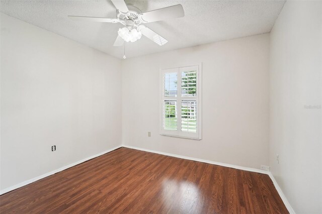 empty room featuring a textured ceiling, hardwood / wood-style floors, and ceiling fan