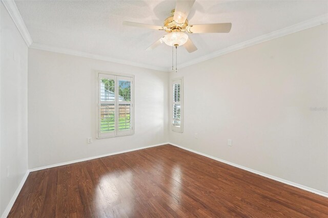 empty room with crown molding, ceiling fan, and hardwood / wood-style flooring