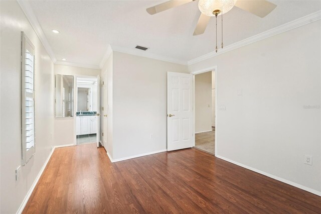 spare room featuring ornamental molding, hardwood / wood-style floors, and ceiling fan