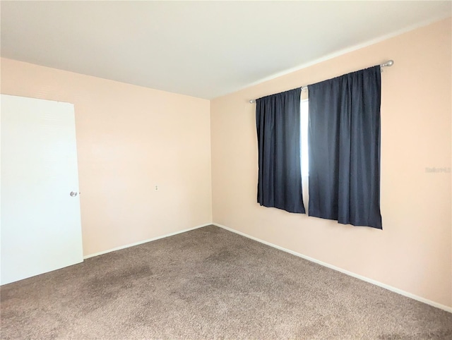 empty room with carpet flooring