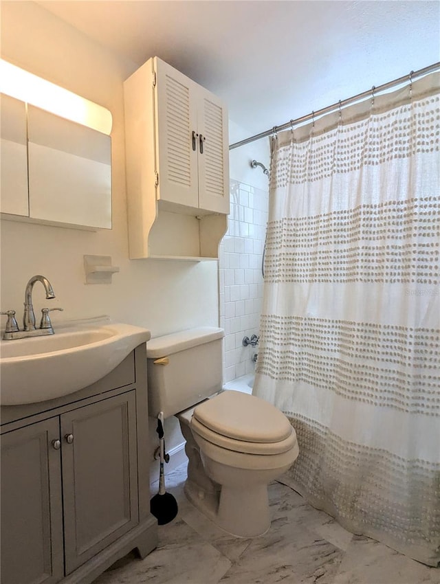 full bathroom featuring tile patterned floors, shower / bath combination with curtain, toilet, and vanity