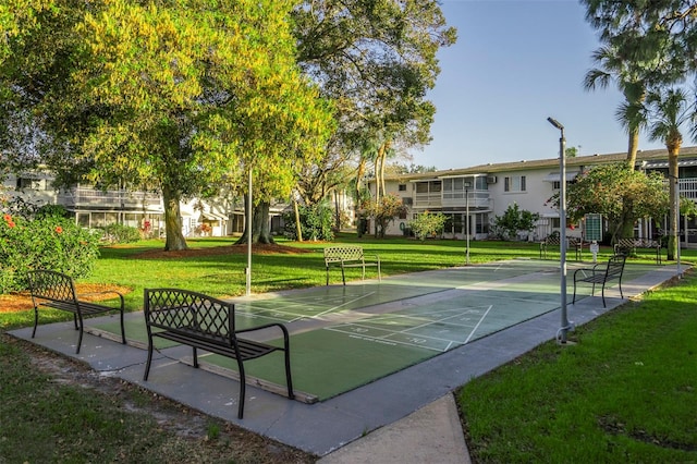 view of home's community with a lawn