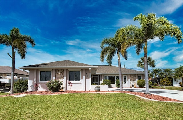 ranch-style house with a front yard