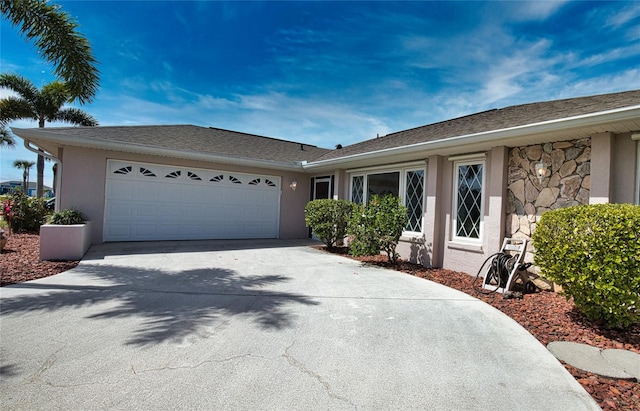 single story home featuring a garage