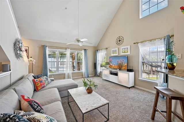 carpeted living room with high vaulted ceiling and ceiling fan