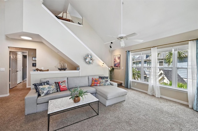 carpeted living room featuring high vaulted ceiling and ceiling fan