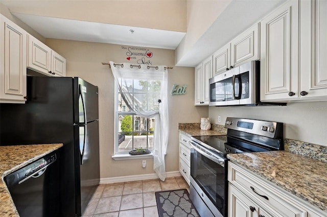 kitchen with black appliances, white cabinetry, and light stone counters