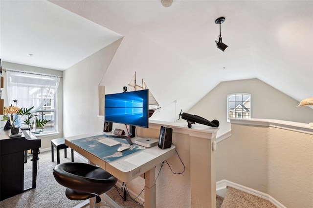 office space with lofted ceiling and carpet