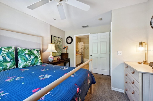 carpeted bedroom featuring ceiling fan and ensuite bathroom