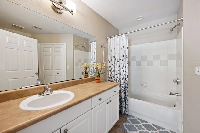 bathroom with vanity, tile patterned floors, and shower / bathtub combination with curtain