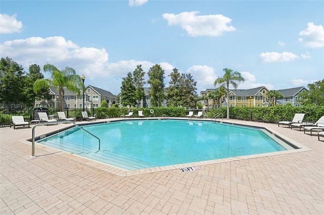 view of pool featuring a patio