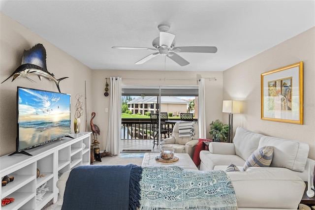 carpeted living room with ceiling fan