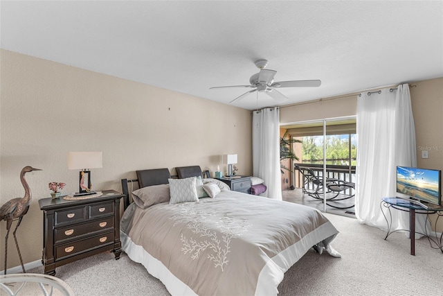 carpeted bedroom with ceiling fan and access to outside