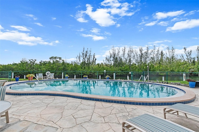 view of pool featuring a patio area