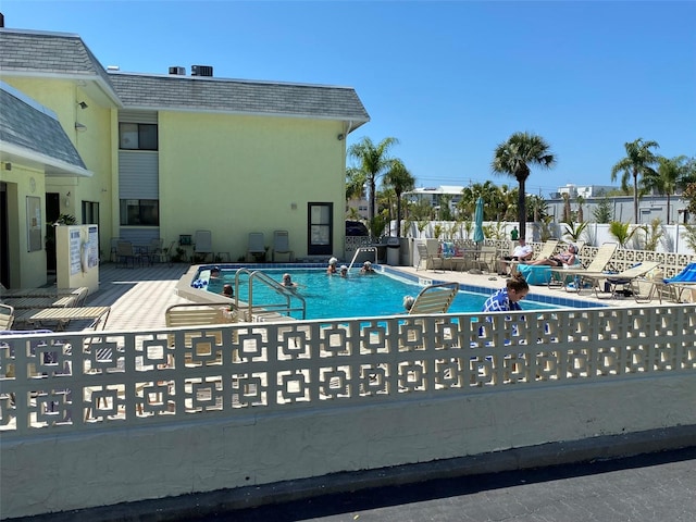 view of swimming pool featuring a patio area