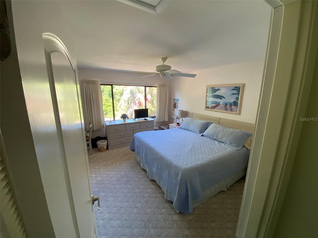 carpeted bedroom featuring ceiling fan