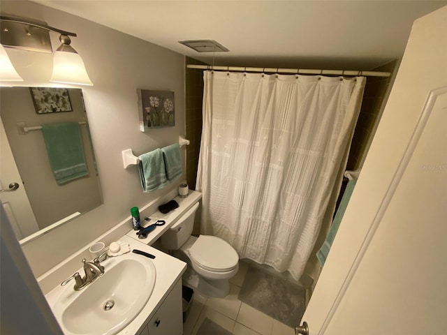 bathroom featuring a shower with shower curtain, vanity, toilet, and tile patterned floors