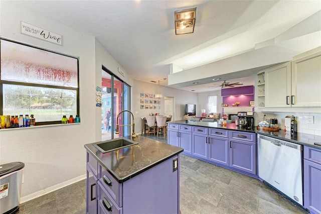 kitchen featuring tile patterned flooring, stainless steel dishwasher, and a healthy amount of sunlight