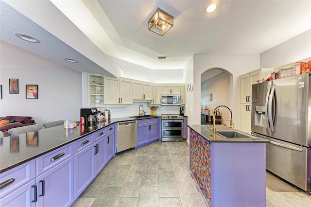 kitchen featuring sink, appliances with stainless steel finishes, and light tile patterned floors