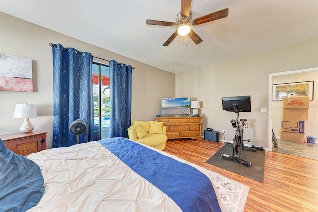 bedroom with ceiling fan and hardwood / wood-style flooring