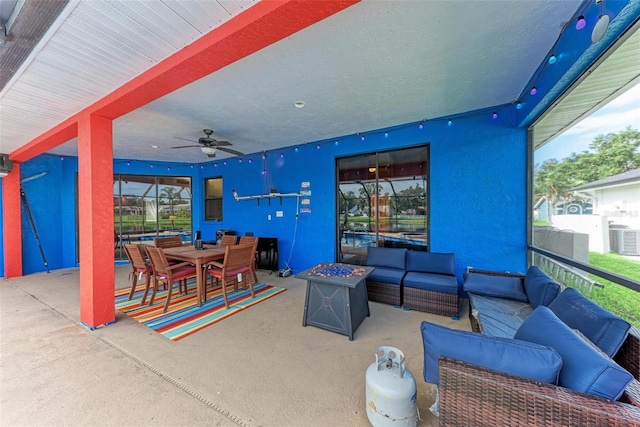 view of patio / terrace with ceiling fan and outdoor lounge area