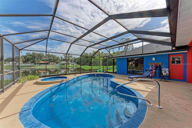 view of swimming pool with glass enclosure, a patio area, an in ground hot tub, and a water view