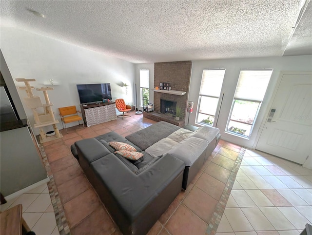 tiled living room with a brick fireplace and a textured ceiling