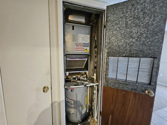 utility room featuring electric water heater