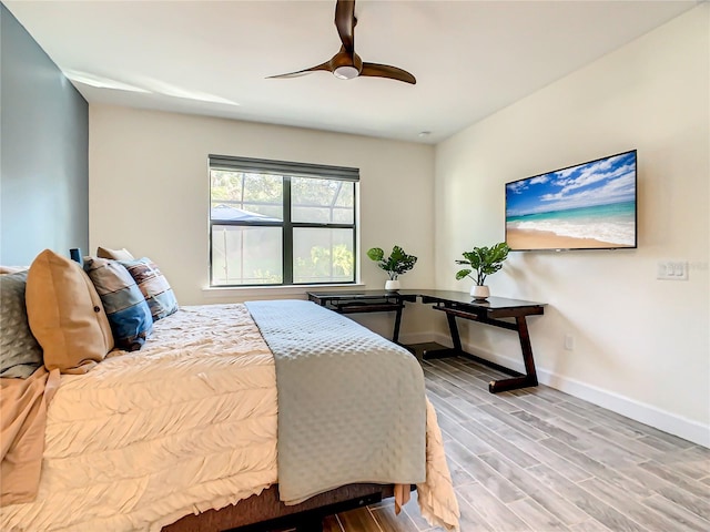 bedroom featuring ceiling fan and hardwood / wood-style flooring