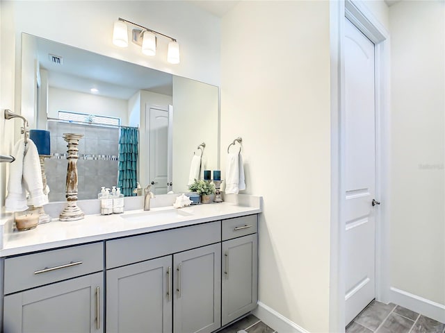 bathroom with vanity and curtained shower