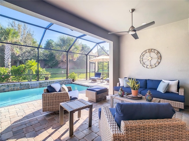 view of patio with a lanai, an outdoor hangout area, and ceiling fan