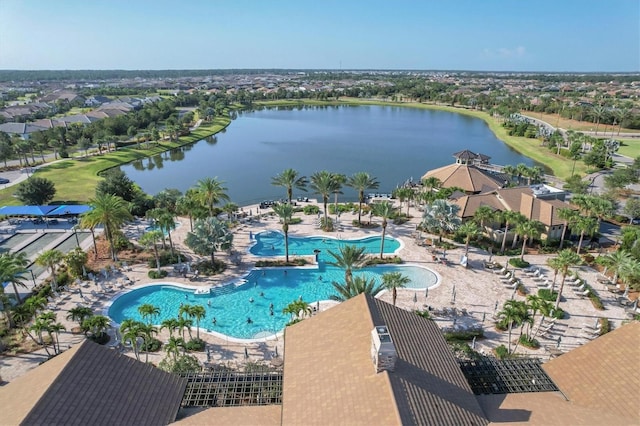 view of pool featuring a patio area and a water view