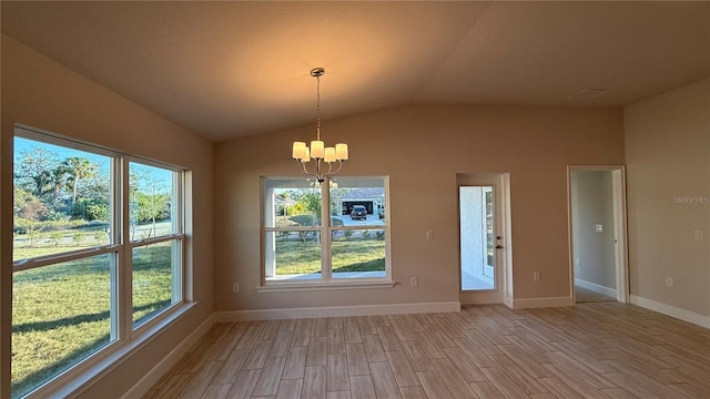 unfurnished dining area with light wood finished floors, baseboards, vaulted ceiling, and a notable chandelier