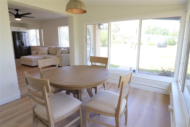 dining area featuring light hardwood / wood-style floors, a wealth of natural light, and ceiling fan