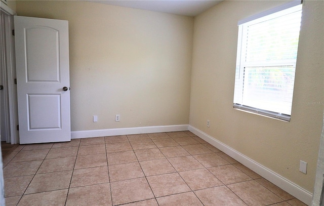 empty room with light tile patterned flooring