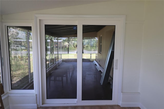 doorway with lofted ceiling