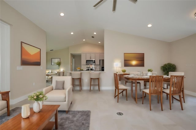 dining room featuring recessed lighting, baseboards, lofted ceiling, and a ceiling fan