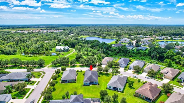 birds eye view of property with a water view