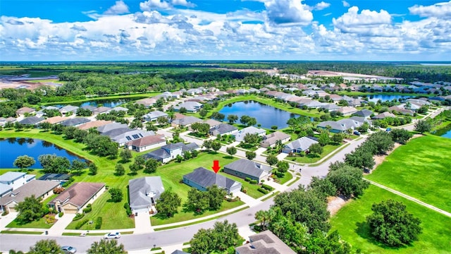 bird's eye view with a water view