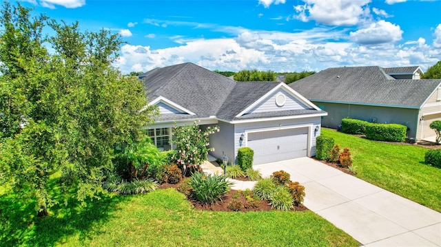 view of front of home featuring a garage and a front yard