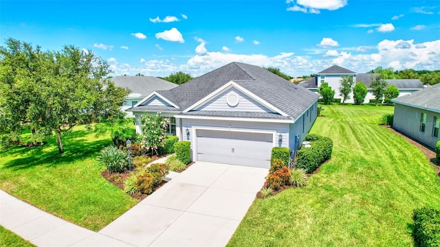 view of front of house featuring a front lawn and a garage