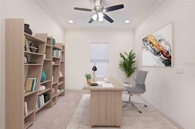 carpeted office space featuring ceiling fan and ornamental molding