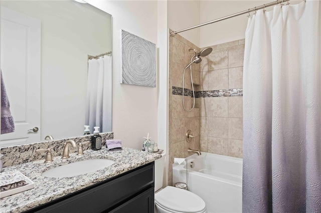 full bathroom with shower / bath combo with shower curtain, vanity, and toilet