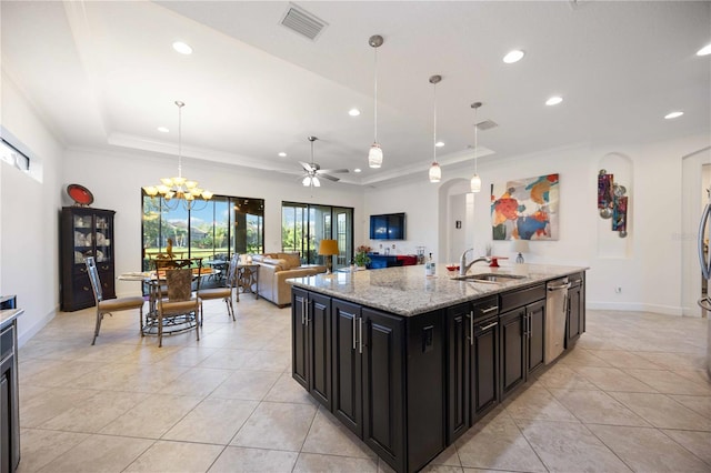 kitchen featuring dishwasher, hanging light fixtures, light stone counters, a tray ceiling, and ceiling fan with notable chandelier