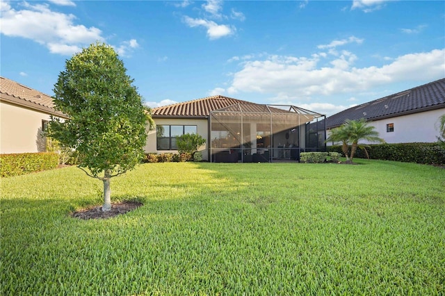 view of yard featuring glass enclosure