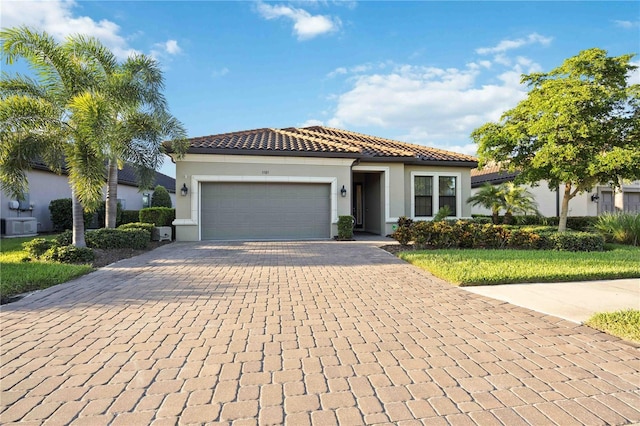 mediterranean / spanish house with a garage