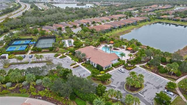 birds eye view of property featuring a water view