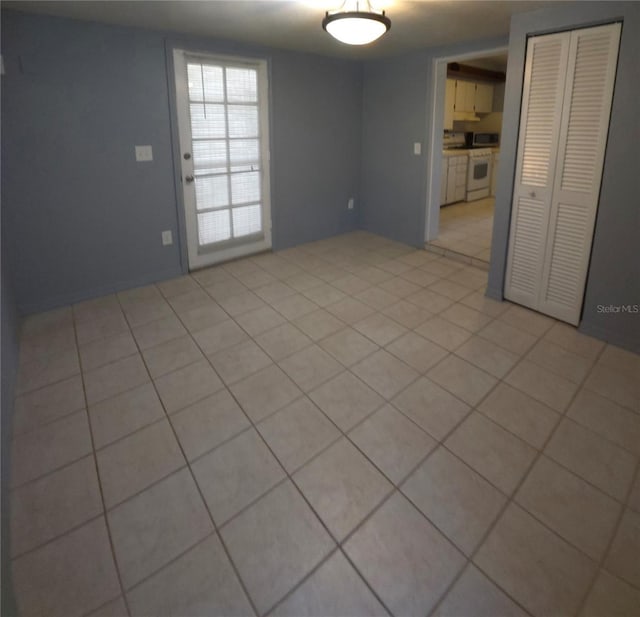 spare room with light tile patterned floors