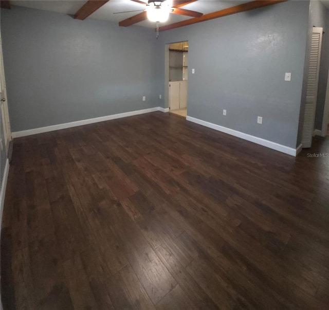 empty room featuring ceiling fan and dark hardwood / wood-style floors