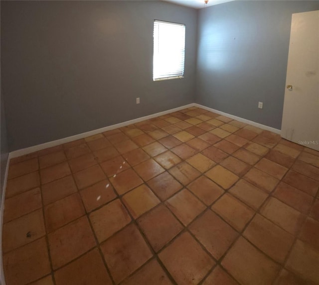 unfurnished room featuring tile patterned floors